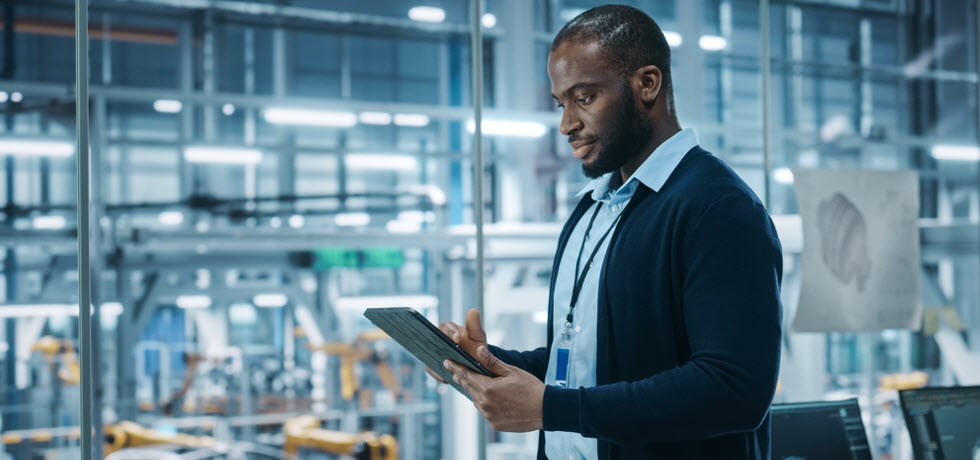 A man controlling automated text messaging on the tablet