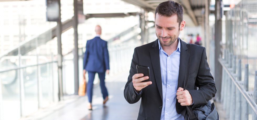 man reading text message