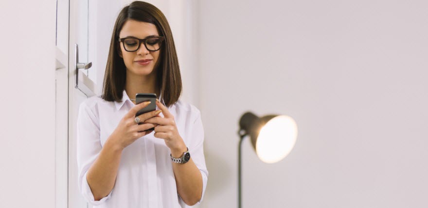 Woman reading text message