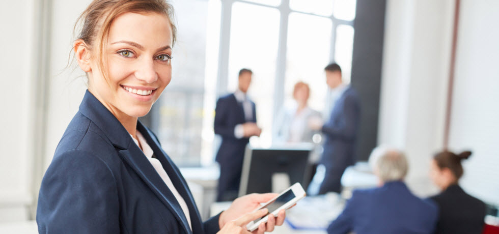 young woman with mobile phone in a meeting